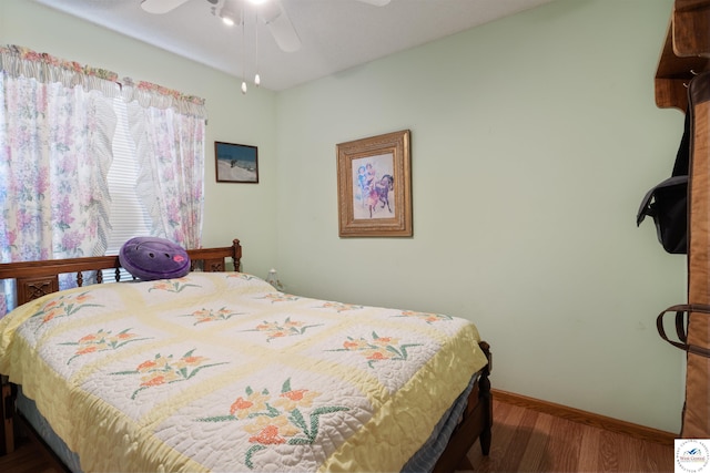 28174 Apex Ave, Warsaw, MO 65355 - bedroom featuring wood finished floors, baseboards, and a ceiling fan