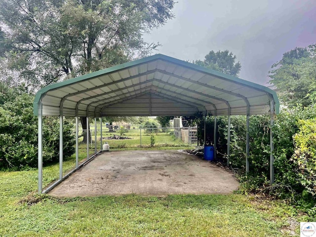 202 Cleveland St, Versailles, MO 65084 - view of car parking featuring fence and a detached carport