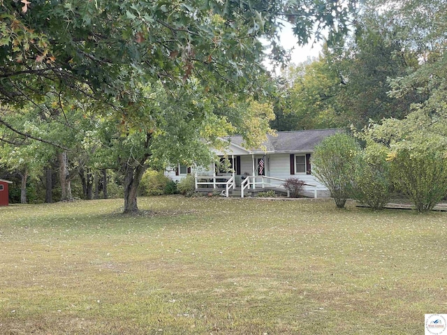 view of front of house with a front lawn and covered porch
