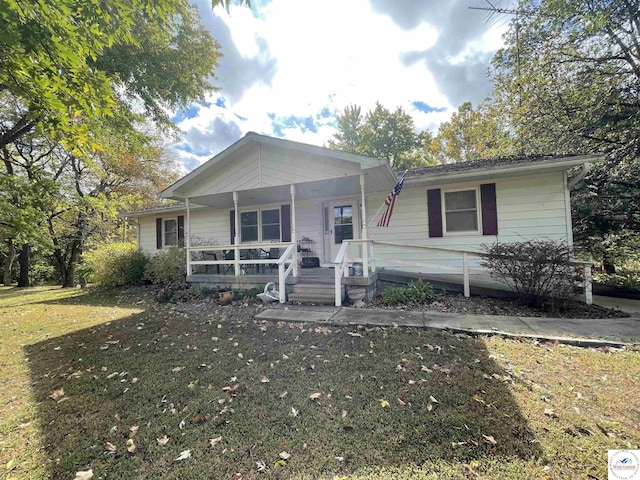 view of front facade with a porch and a front lawn