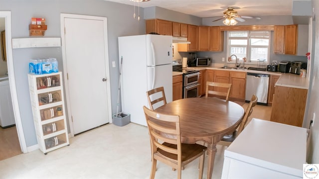 252 Shawn Ave, Lincoln, MO 65338 - kitchen with appliances with stainless steel finishes, under cabinet range hood, a sink, a ceiling fan, and light countertops