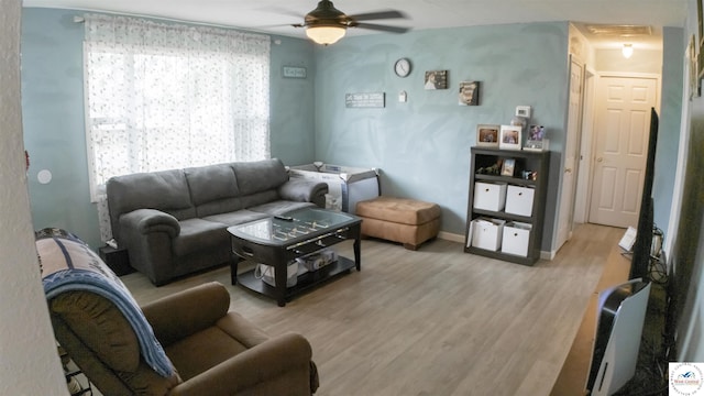 252 Shawn Ave, Lincoln, MO 65338 - living room featuring light wood-type flooring, ceiling fan, and baseboards