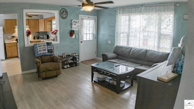 252 Shawn Ave, Lincoln, MO 65338 - living area with ceiling fan, light wood-style flooring, and baseboards