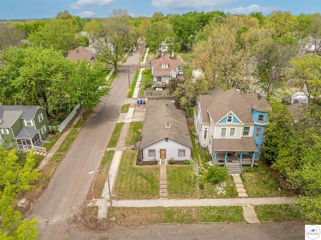 birds eye view of property with a residential view