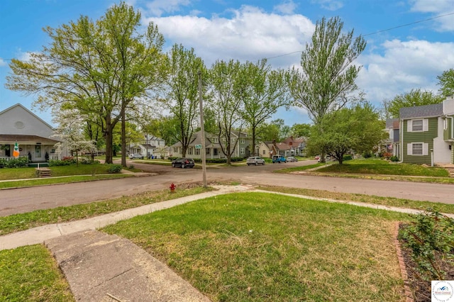 view of road with sidewalks and a residential view