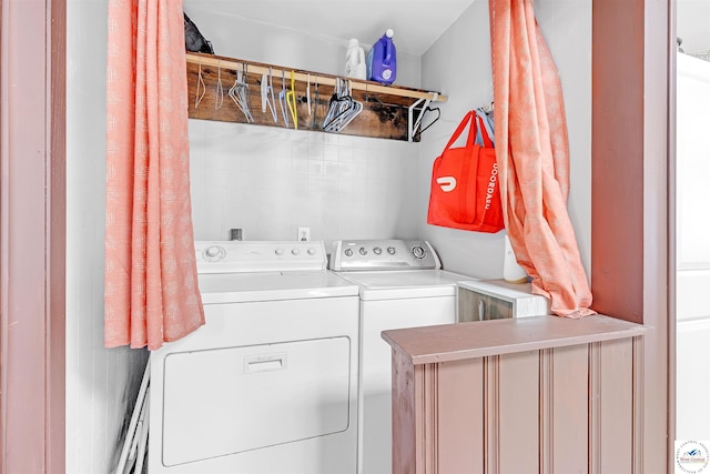 laundry area featuring laundry area and washer and clothes dryer