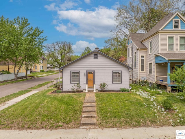 bungalow with a front lawn
