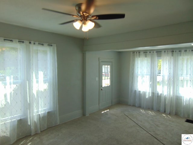 311 N Water St, Clinton, MO 64735 - spare room featuring ceiling fan, carpet, and baseboards