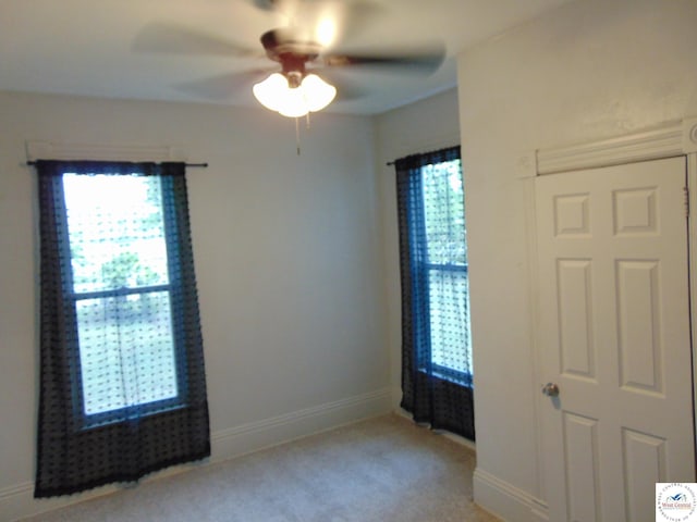 311 N Water St, Clinton, MO 64735 - carpeted empty room with a ceiling fan and baseboards