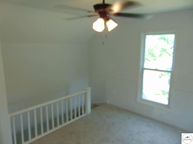 311 N Water St, Clinton, MO 64735 - carpeted empty room with radiator heating unit and ceiling fan
