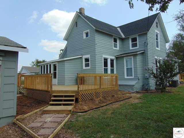 311 N Water St, Clinton, MO 64735 - rear view of property with a chimney, a yard, central air condition unit, and a deck