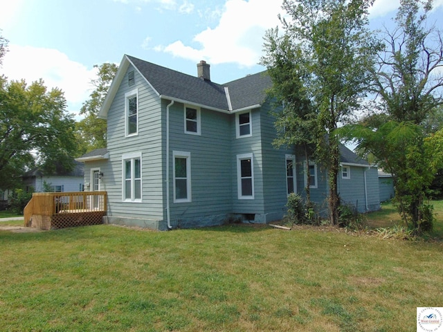 311 N Water St, Clinton, MO 64735 - rear view of property with a lawn, a wooden deck, a shingled roof, and a chimney