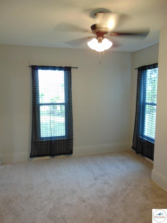 311 N Water St, Clinton, MO 64735 - carpeted empty room with a ceiling fan and baseboards
