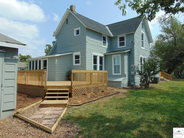 311 N Water St, Clinton, MO 64735 - rear view of house featuring a lawn, roof with shingles, a deck, and central air condition unit