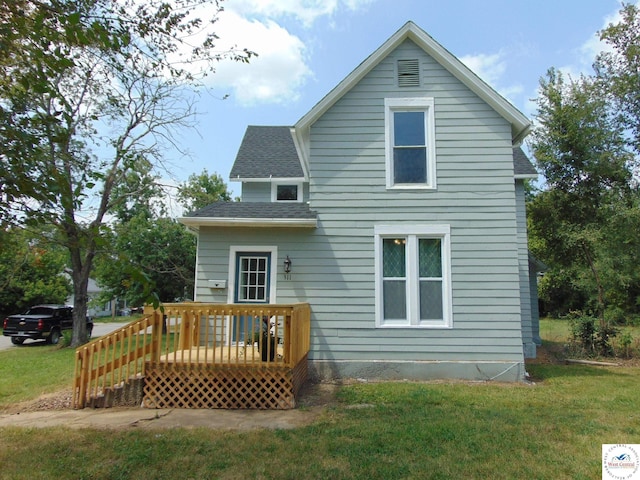 311 N Water St, Clinton, MO 64735 - back of house with a deck, a shingled roof, and a yard