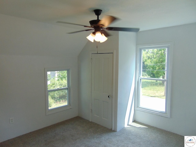 311 N Water St, Clinton, MO 64735 - unfurnished bedroom featuring a ceiling fan, multiple windows, and carpet floors
