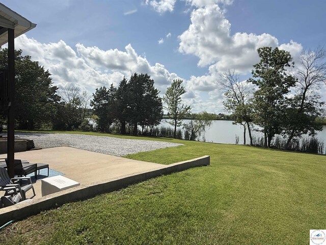 225 Crescent Dr, Lincoln, MO 65338 - view of grassy yard featuring a water view and a patio