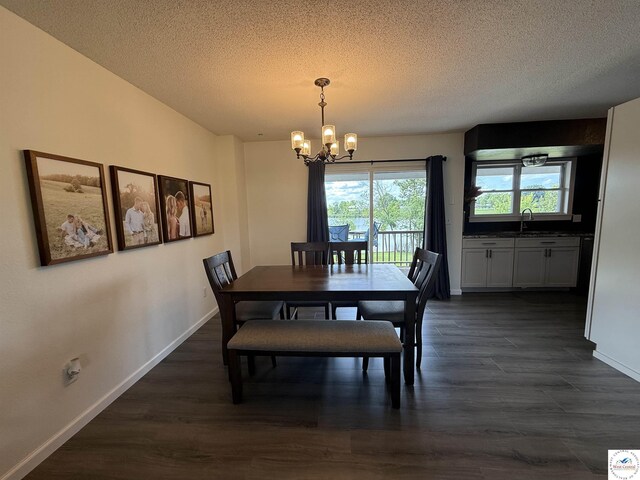 225 Crescent Dr, Lincoln, MO 65338 - dining room with a chandelier, a textured ceiling, and dark wood-style flooring