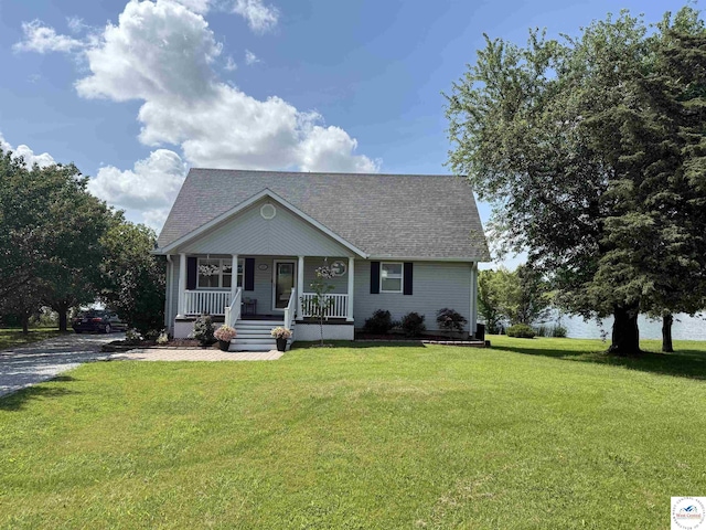 225 Crescent Dr, Lincoln, MO 65338 - view of front of house featuring covered porch, roof with shingles, and a front yard