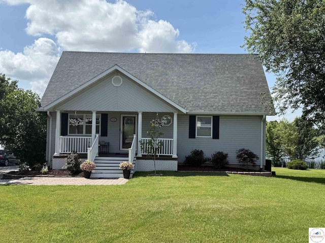 225 Crescent Dr, Lincoln, MO 65338 - view of front of home with covered porch, a front lawn, and a shingled roof