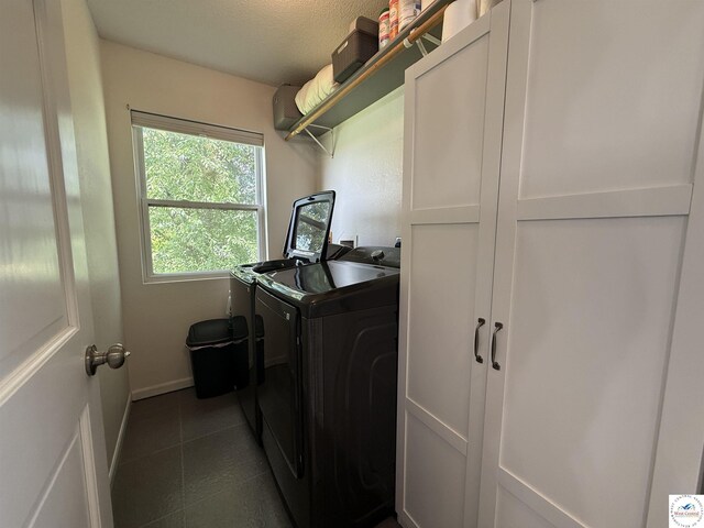 225 Crescent Dr, Lincoln, MO 65338 - laundry room with washing machine and dryer and dark tile patterned flooring