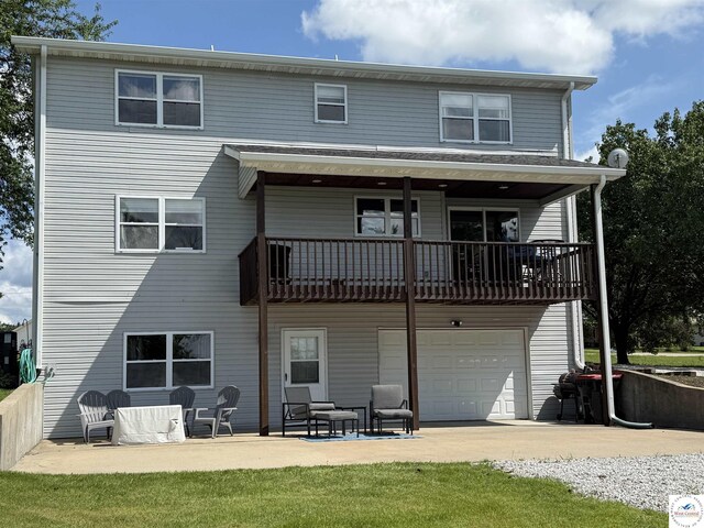 225 Crescent Dr, Lincoln, MO 65338 - rear view of property featuring a garage, a balcony, and driveway
