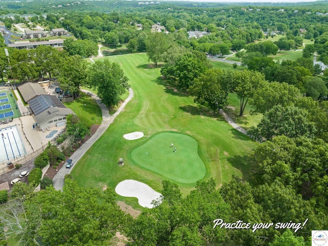 birds eye view of property with view of golf course