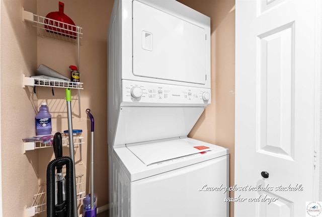 laundry area featuring stacked washing maching and dryer and laundry area