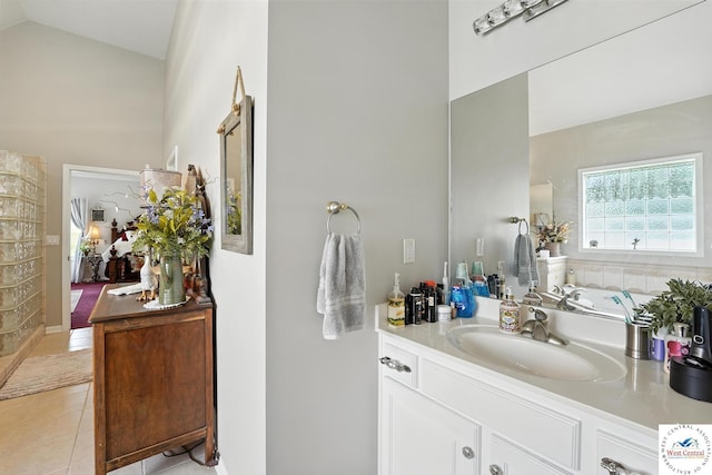 414 S Borgman Rd, Buckner, MO 64016 - full bath featuring vanity, tile patterned flooring, and high vaulted ceiling