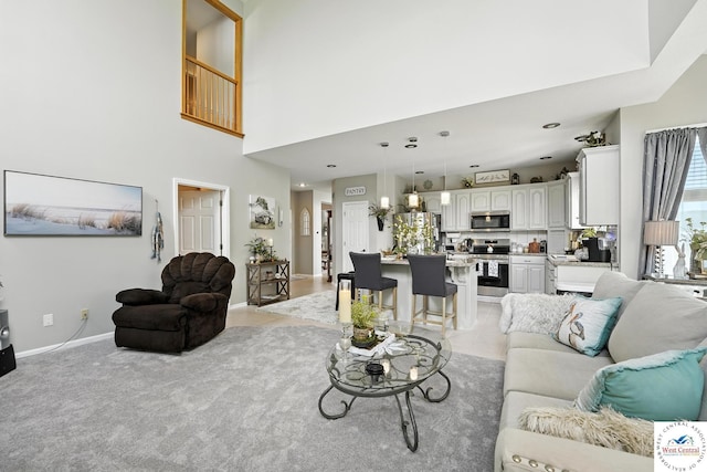 414 S Borgman Rd, Buckner, MO 64016 - living room featuring baseboards and a high ceiling
