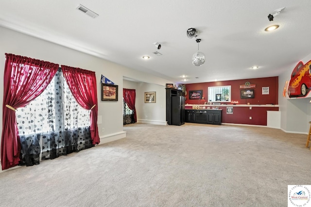 414 S Borgman Rd, Buckner, MO 64016 - unfurnished living room featuring light colored carpet and recessed lighting