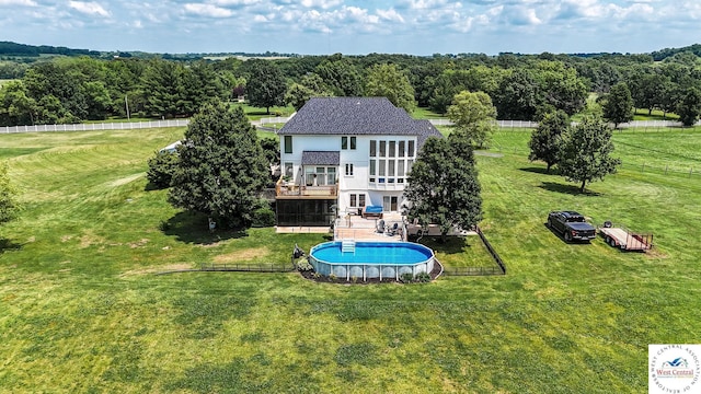 414 S Borgman Rd, Buckner, MO 64016 - rear view of house featuring a balcony, a fenced backyard, an outdoor pool, a patio, and stucco siding