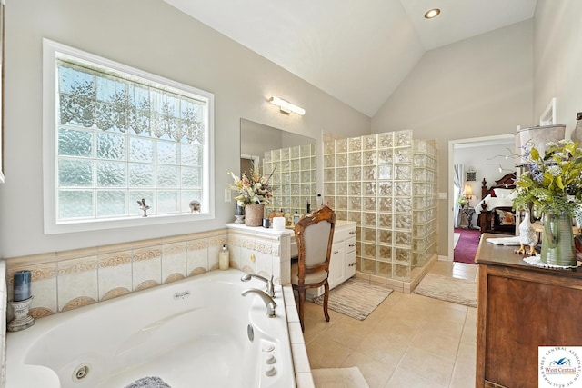 414 S Borgman Rd, Buckner, MO 64016 - bathroom with a whirlpool tub, lofted ceiling, and tile patterned floors