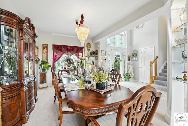 414 S Borgman Rd, Buckner, MO 64016 - dining area with a chandelier, light carpet, and stairway