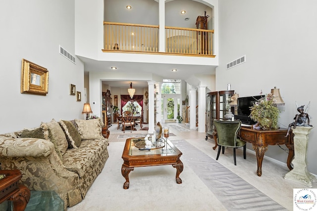 414 S Borgman Rd, Buckner, MO 64016 - living area featuring decorative columns, carpet flooring, and a high ceiling