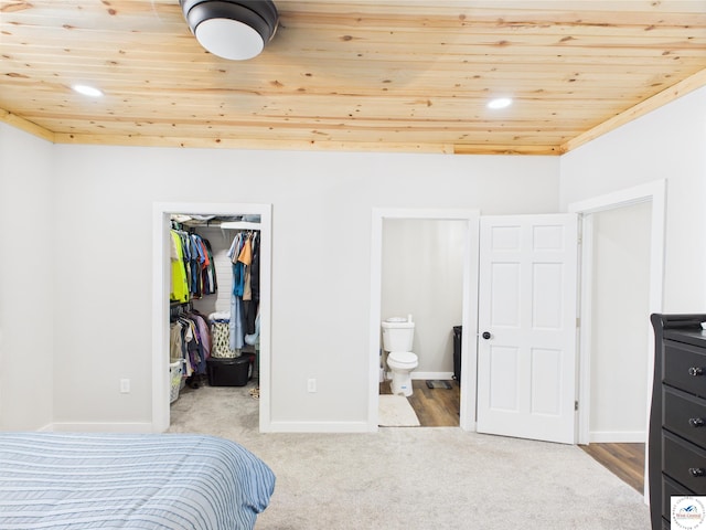 1407 E Main St, Higginsville, MO 64037 - bedroom with wooden ceiling, a spacious closet, carpet floors, ensuite bathroom, and a closet