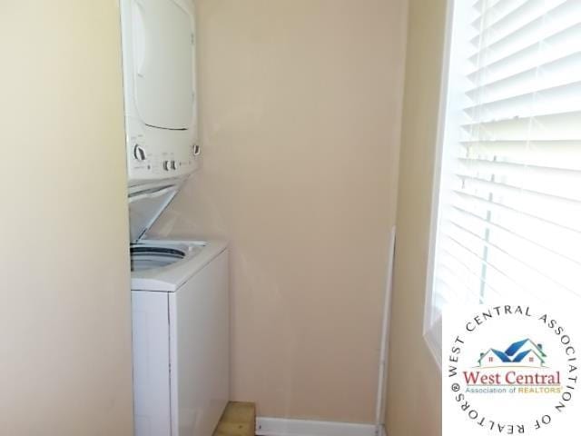 laundry room featuring stacked washing maching and dryer
