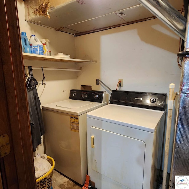 2206 N Swisher Dr, Clinton, MO 64735 - clothes washing area featuring washing machine and clothes dryer and laundry area