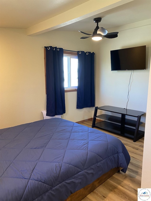 bedroom featuring wood finished floors and a ceiling fan