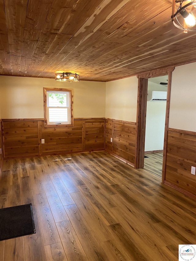below grade area with wood walls, a wainscoted wall, and wood ceiling
