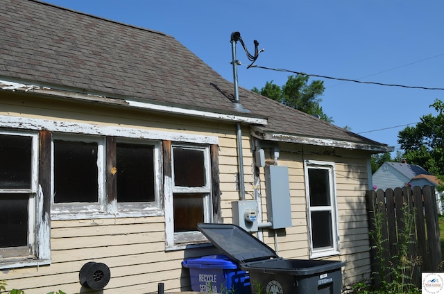 1305 E 14th St, Sedalia, MO 65301 - view of side of property with roof with shingles