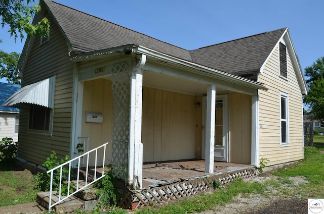1305 E 14th St, Sedalia, MO 65301 - view of home's exterior with roof with shingles