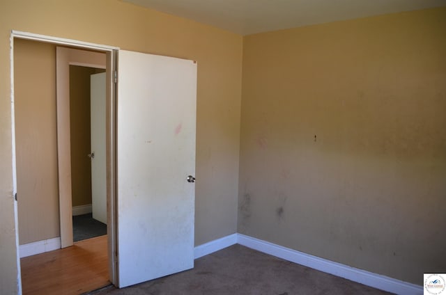 1305 E 14th St, Sedalia, MO 65301 - unfurnished bedroom with baseboards