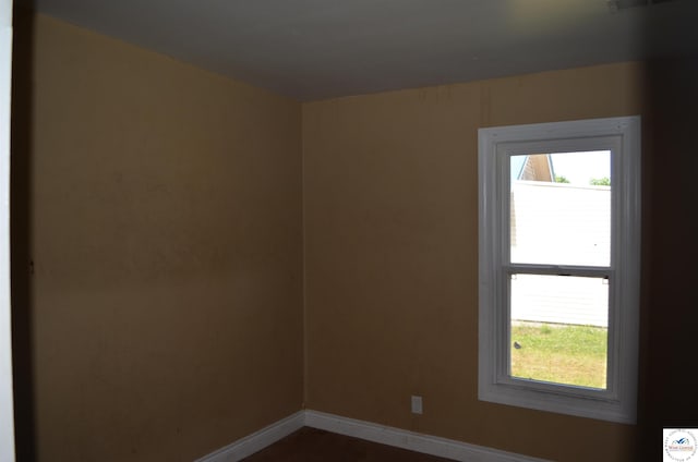 1305 E 14th St, Sedalia, MO 65301 - unfurnished room featuring baseboards and plenty of natural light