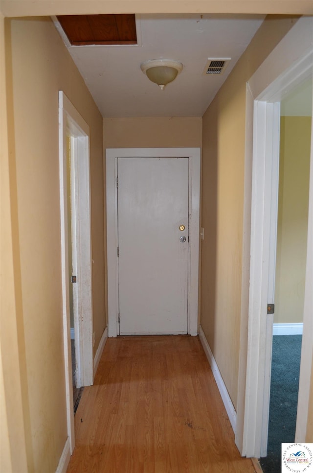 1305 E 14th St, Sedalia, MO 65301 - hallway featuring light wood-style floors and baseboards