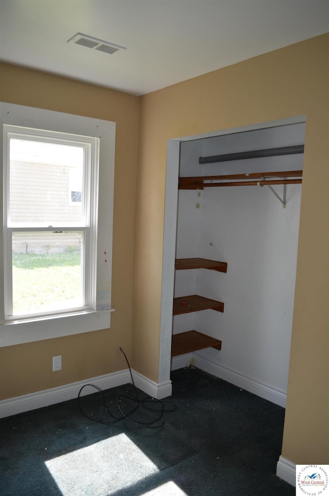 1305 E 14th St, Sedalia, MO 65301 - unfurnished bedroom with carpet, baseboards, and a closet
