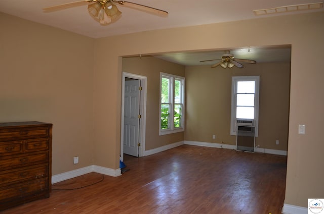 1305 E 14th St, Sedalia, MO 65301 - spare room featuring ceiling fan, wood finished floors, and baseboards