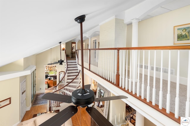 1114 W Broadway Blvd, Sedalia, MO 65301 - stairs with lofted ceiling, decorative columns, and wood finished floors