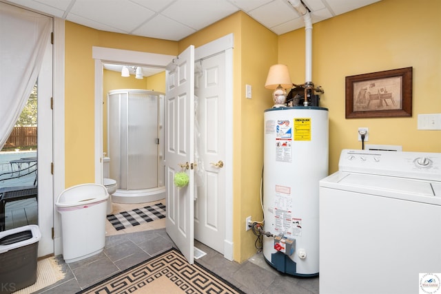 laundry room with tile patterned flooring, water heater, laundry area, and washer / clothes dryer