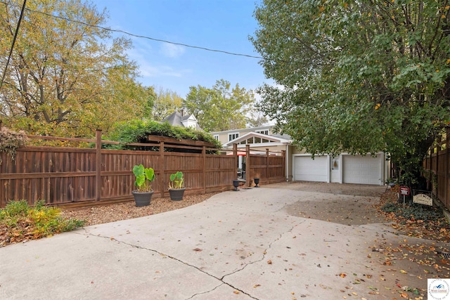 exterior space featuring fence and driveway